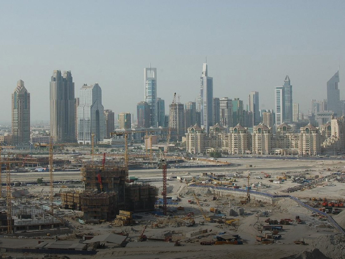 2006: Burj Khalifa construction work in progress. Construction of the Burj Khalifa began in 2004, with the exterior completed five years later in 2009 and was opened in 2010 as part of a new development called Downtown Dubai.