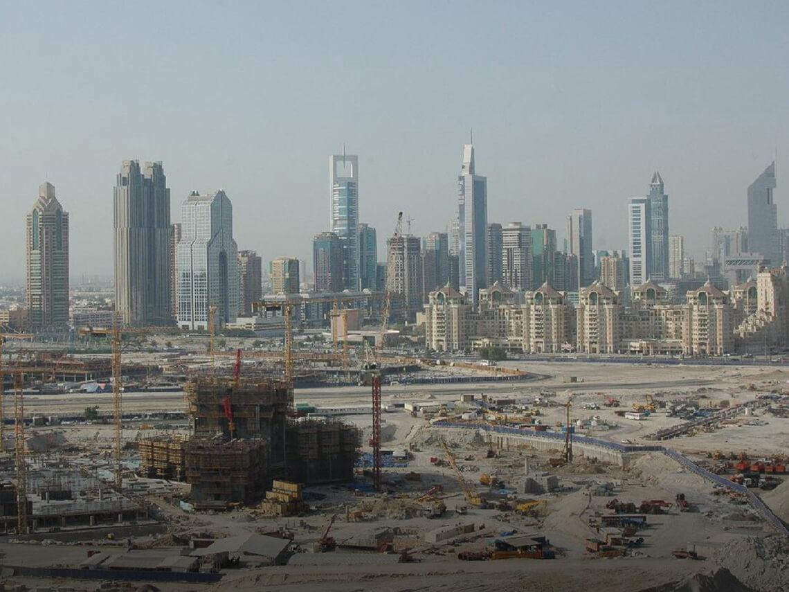 2006: Burj Khalifa construction work in progress. Construction of the Burj Khalifa began in 2004, with the exterior completed five years later in 2009 and was opened in 2010 as part of a new development called Downtown Dubai.